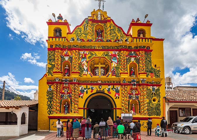 a group of people in front of the church in San Andrés Xecul
