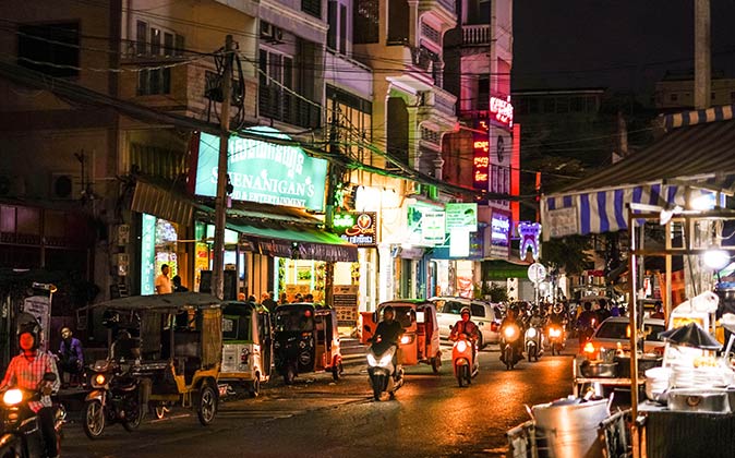 a crowded street at night in Phnom Penh