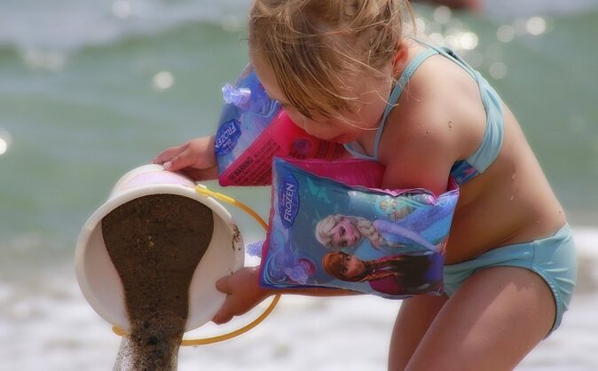 young girl playing on the beach in Valencia