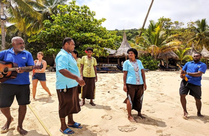 a group of locals singing in Fiji