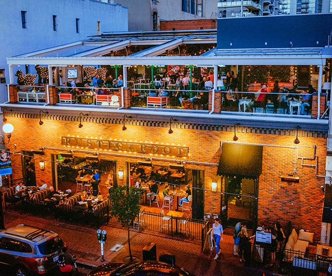 a view of Rustic Root rooftop bar at night