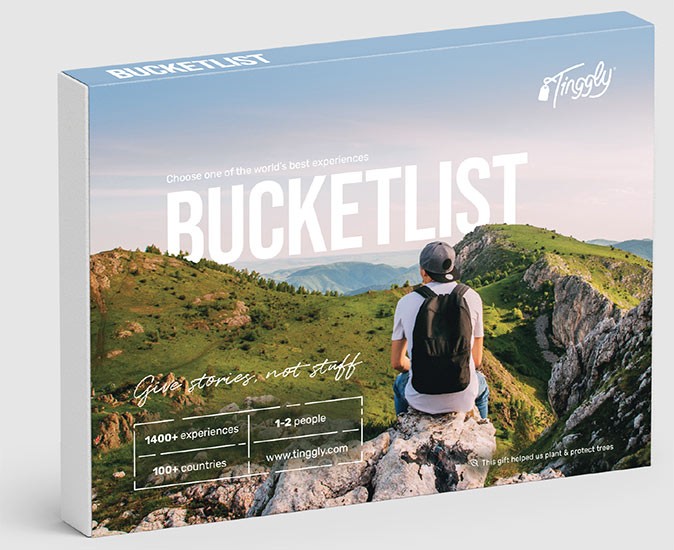 A great digital nomad gift idea A picture of a gift box with an image of a man sitting on a rock on top of a mountain with the text 'bucketlist'