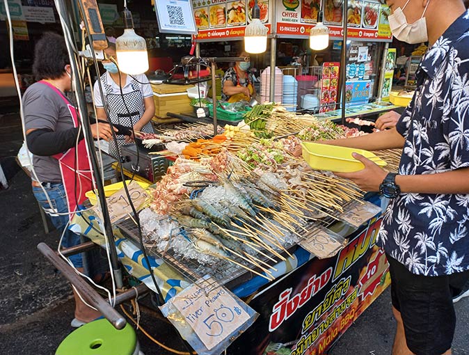 a street food vendor at one of the night markets