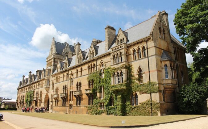 Living in Oxford, UK A posh looking historic building partially overgrown with green plants