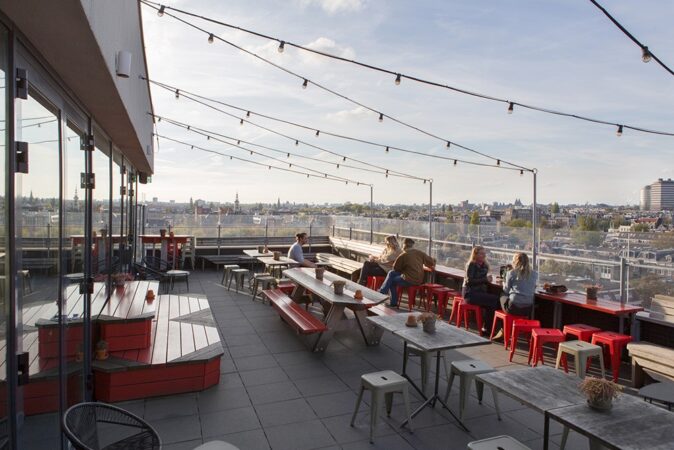 Visiting Amsterdam - tips for the best views checking the view from a rooftop while visiting Amsterdam
