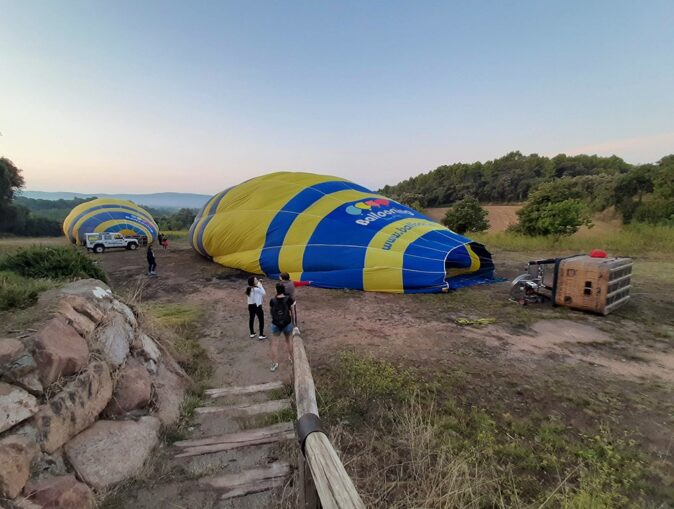 arriving at our hot air balloon Barcelona location 2 hot air balloons in a field being inflated