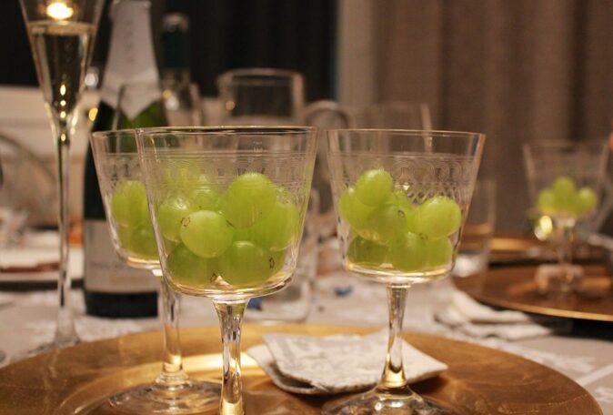 Spanish Christmas: traditions and dates several fancy glasses filled with grapes, as part of a Spanish Christmas tradition