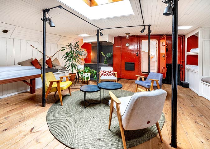a quirky hotel in Amsterdam the interior of one of the boats that has been converted to a hotel