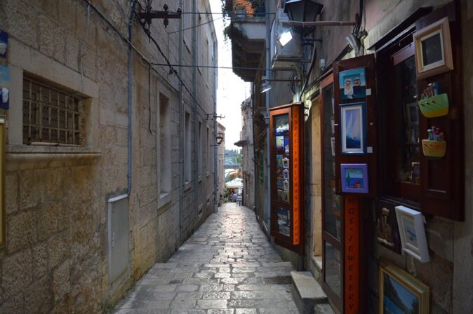 a narrow alley in Korčula, Croatia a narrow alley in Korčula, Croatia