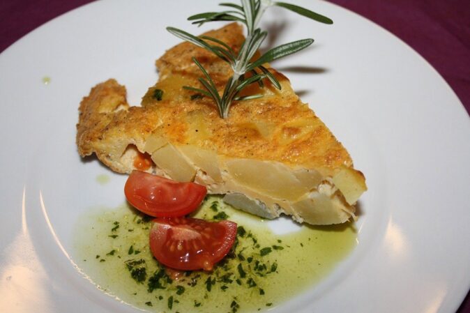 a slice of tortilla de patatas a slice of tortilla de patatas
