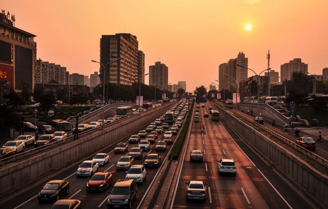 busy traffic in Beijing at sunset