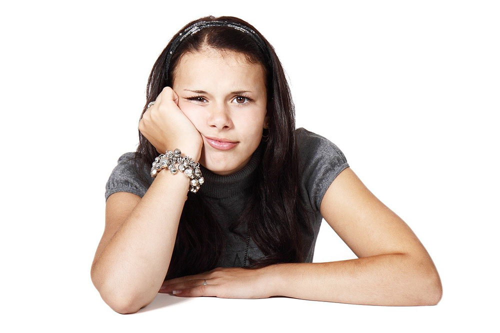 girl thinking about things to do at home when bored