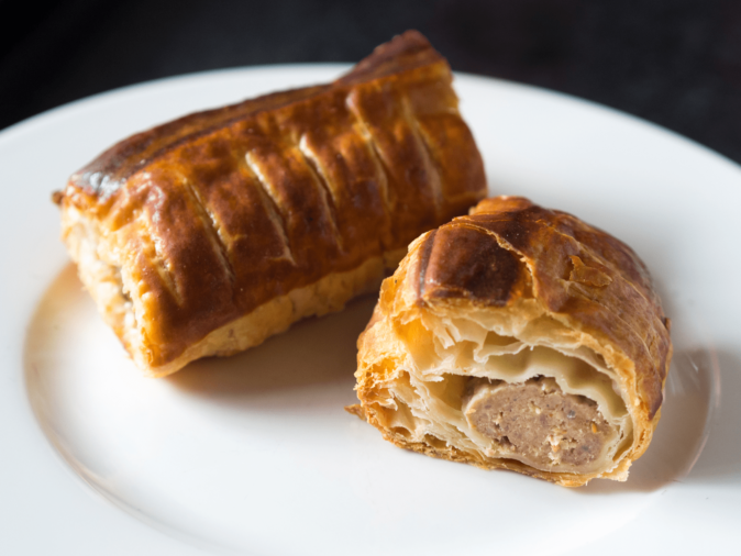 a sauzijnebroodje, popular Dutch food a saucijzenbroodje on a plate