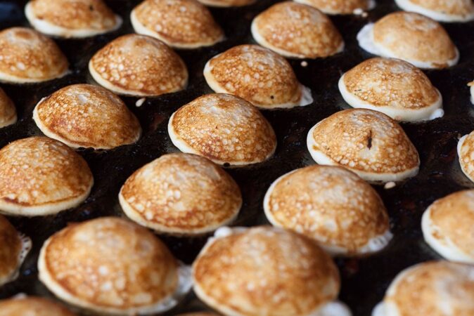 poffertjes as a Dutch snack or lunch cooking poffertjes as a Dutch snack or lunch