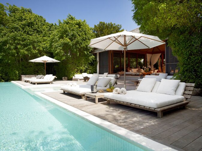 the pool area of a luxury villa in Turks and Caicos the pool area of a luxury villa in Turks and Caicos