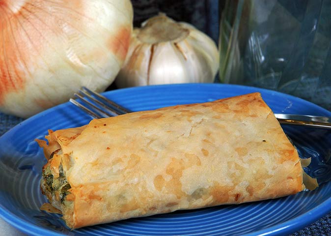 a plate with spanakopita