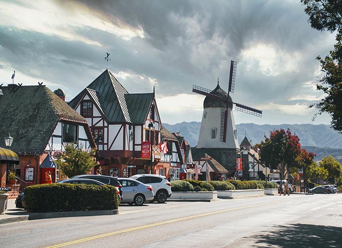 a windmill and traditional buildings in Solvang