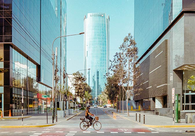 a woman cycling in the San Isidro neighborhood of Lima