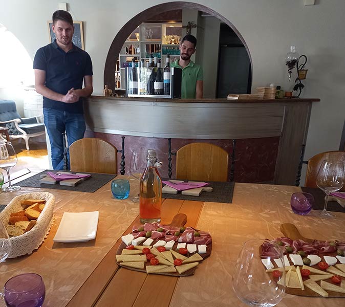 local, cheese, local wine and the vineyard owner in the background