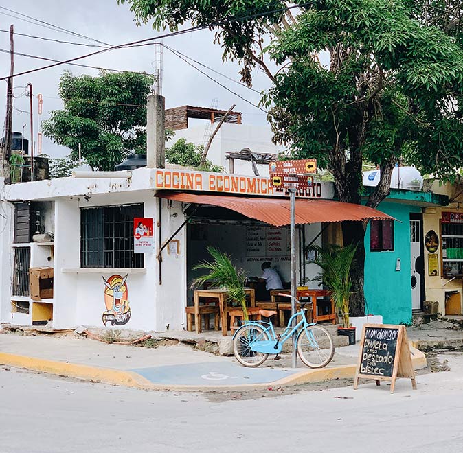 a restaurant in the center of Tulum with a bicylce in front of it