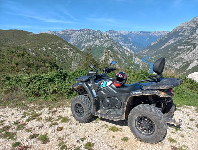 Goranci as a base for remote workers in Bosnia a quad bike with a valley in the background