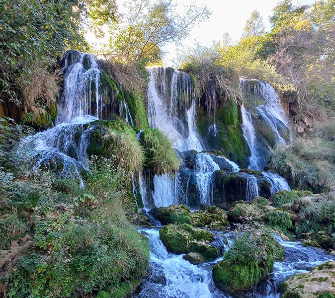 explore Bosnia by car while working remotely a large waterfall in Bosnia