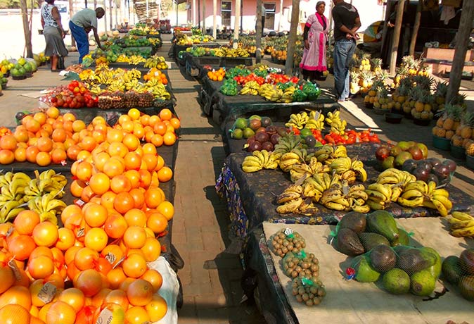 fruit and vegetable stalls at a market in South Africa