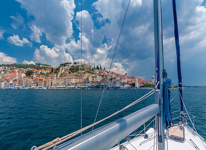 View from a sailboat looking out towards a Croatian island