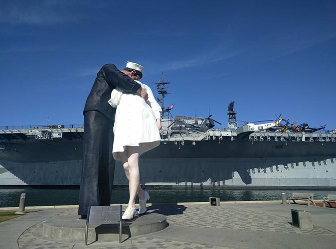 One of the best things to do in San Diego, even on a budget San Diego's famous kissing statue next to the USS Midway Museum