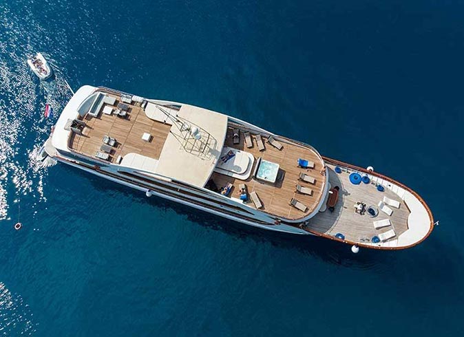 A small ship cruise in Croatia photographed from above surrounded by water