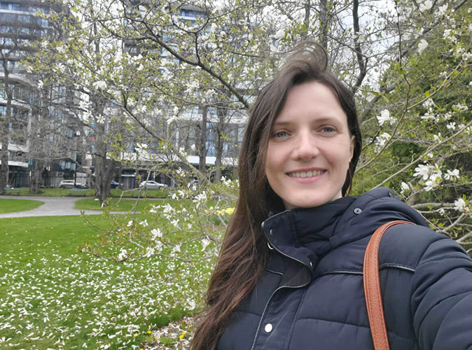a woman taking a selfie in a park