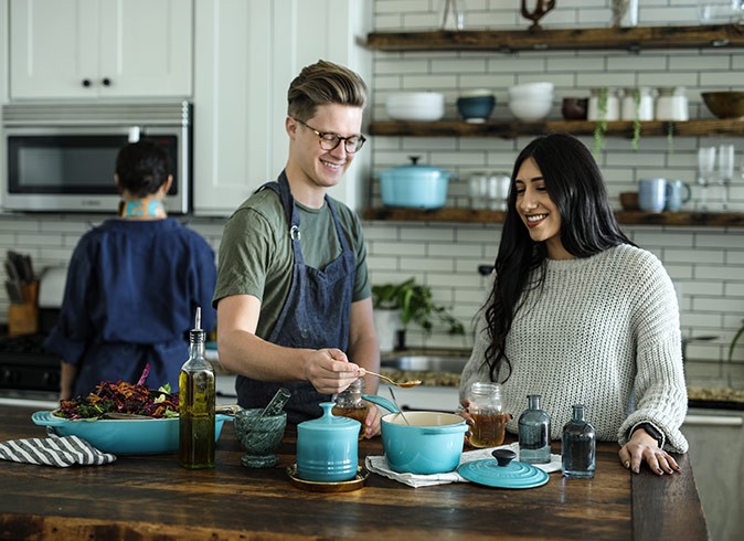 A cooking class, a great activity for couples in Spain a man and a woman cooking together in a modern kitchen