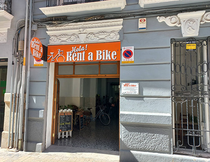visit Valencia responsibly the storefront of a bike rental place in Valencia