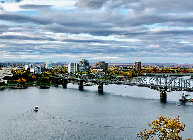 Ottawa, Canada An aerial view of a cityscape and large bridge crossing a river