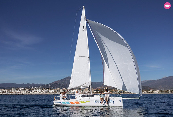 Things to do in Marbella for families A family on a white sailboat off the coast of Marbella