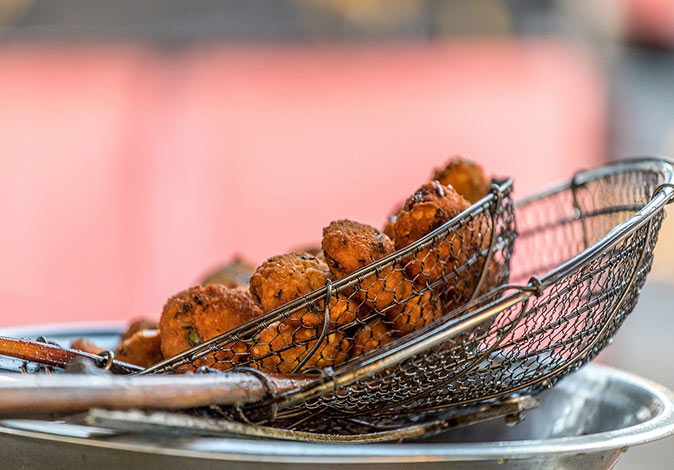 Food in Mauritius close-up of round, deep-fried snacks