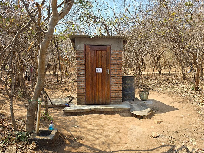 Facilities while volunteering with elephants in Malawi A small brick building in a dry, African setting