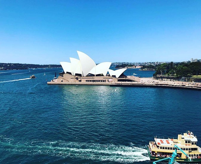 Sydney, an expensive city to live in Australia The famous Sydney Opera House surrounded by water with a ferry in the foreground