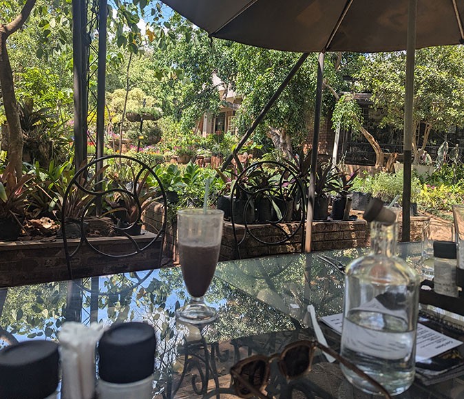 Living in Lilongwe, Malawi A table in a restaurant with an iced drink on it