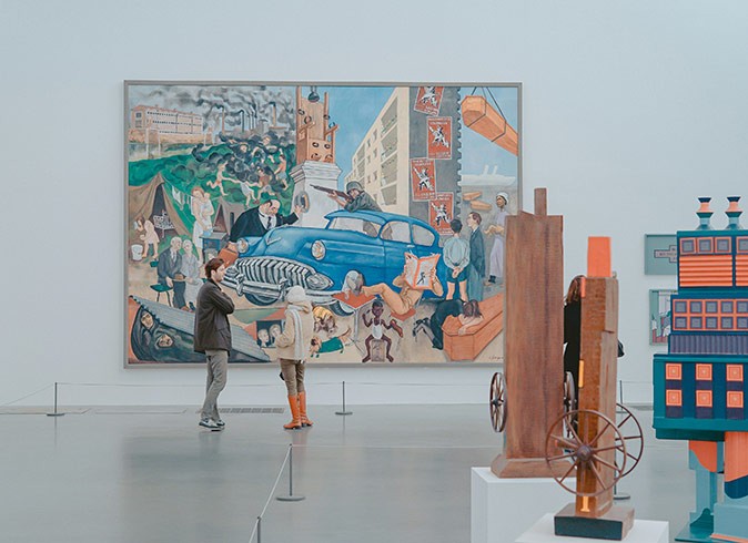 art inside a museum with several people