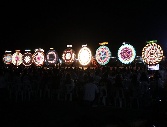 A Christmas tradition in the Philippines A row of different round lanterns in the dark