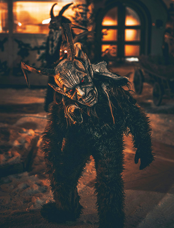 A unique and somewhat weird Christmas tradition A person dressed in a monster-like creature looking at the camera