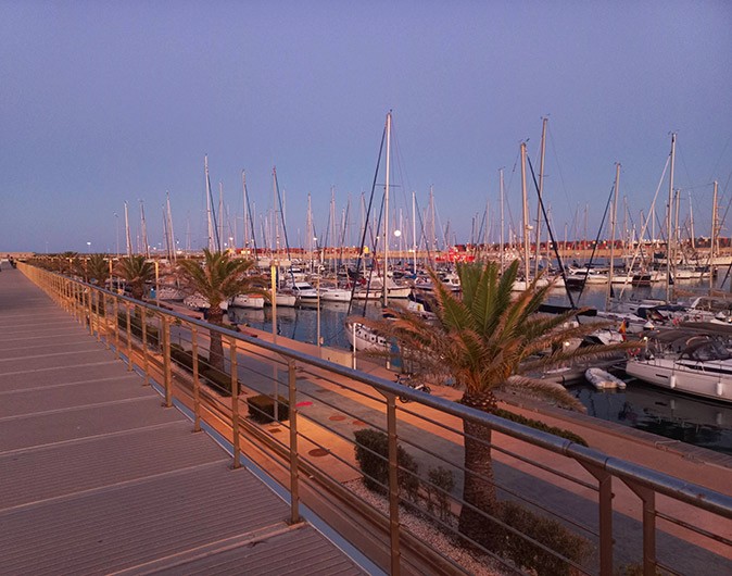 A popular marina in Spain Boats at a marina at sunset