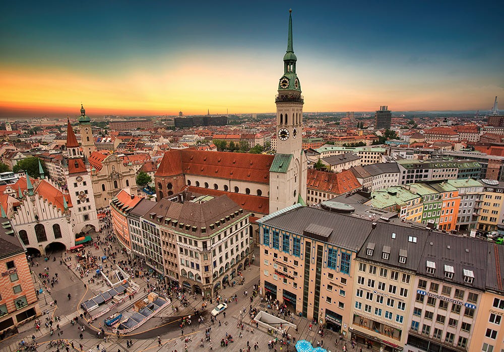 aerial view of a city with historic buildings at sunset