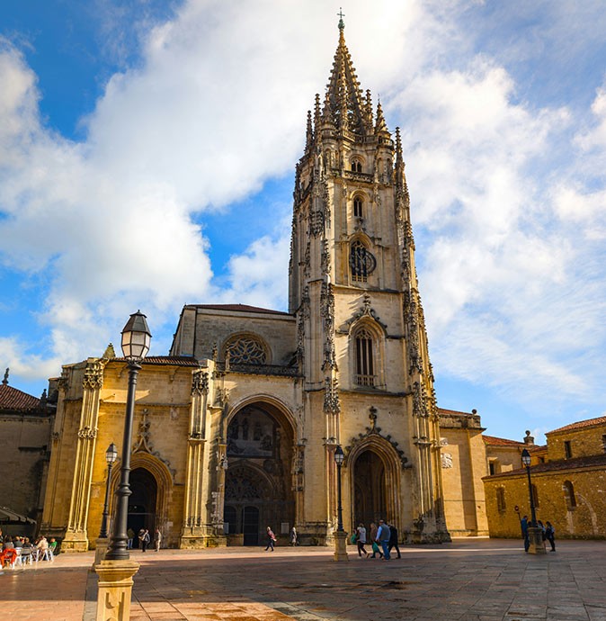 Oviedo, Spain A large brown church on a city square