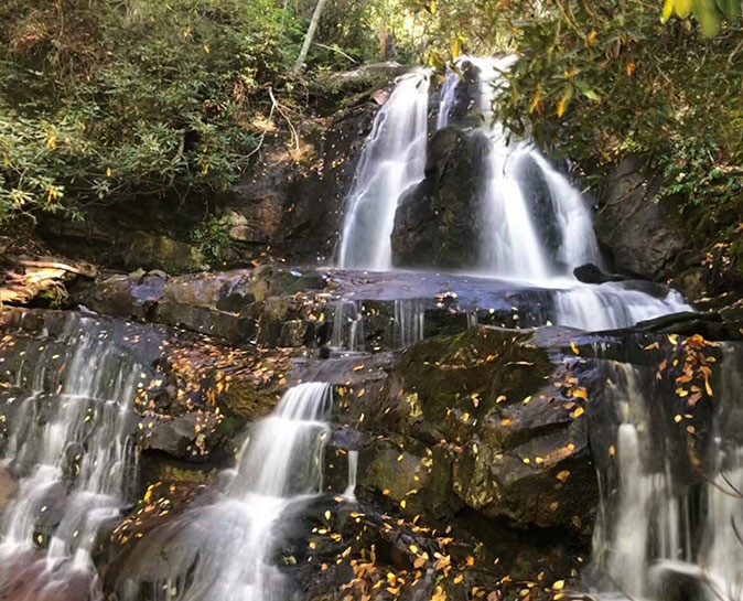 Hiking around Gatlinburg A waterfall in a forest setting