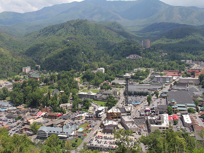 Practical tips for visiting Gatlinburg Aerial view of a town surrounded by green mountains