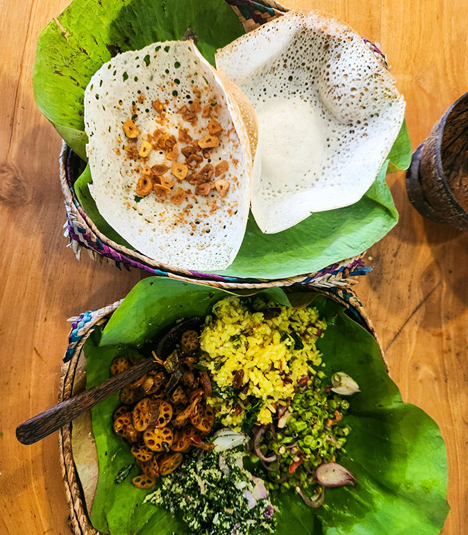Traditional Sri Lankan food Traditional Sri Lankan food on two plates covered with palm leaves