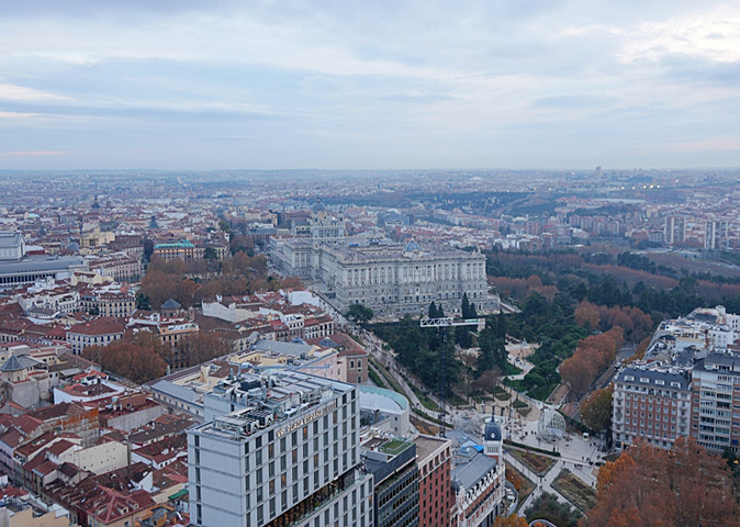 Where to live in Madrid Aerial view of the skyline of Madrid showing mainly apartment blocks, a few historical buildings and a large park