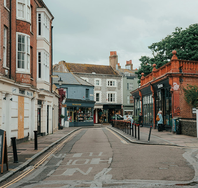 A street lined with gray and brown buildings